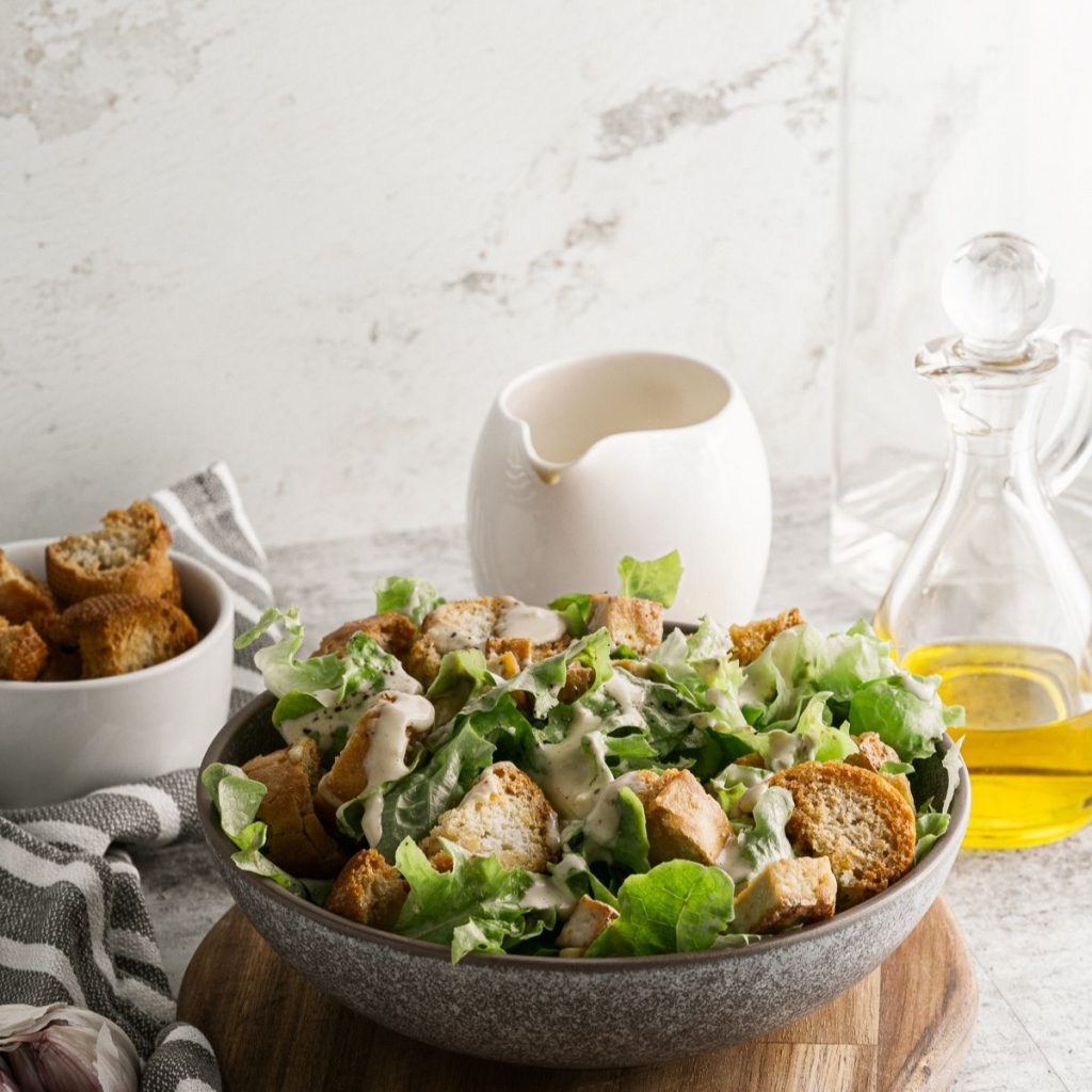 vegan caesar salad in a grey serving bowl