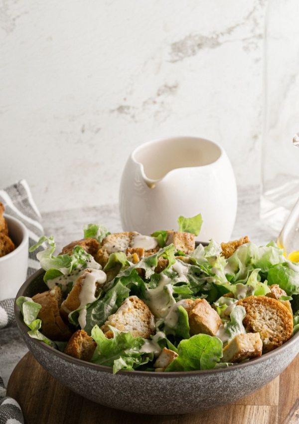 vegan caesar salad in a grey serving bowl