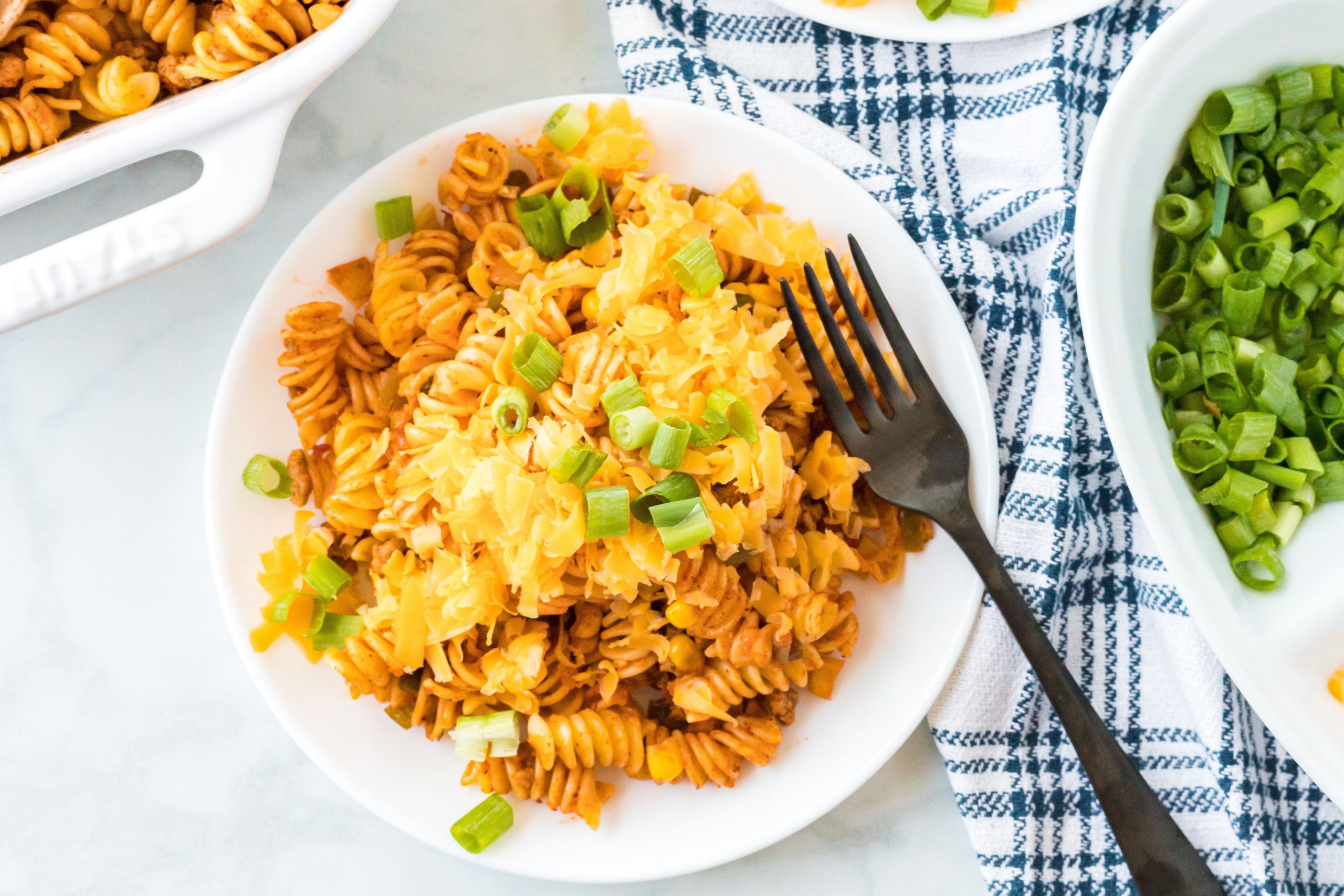 a serving of mexican pasta bake on a plate with a fork.