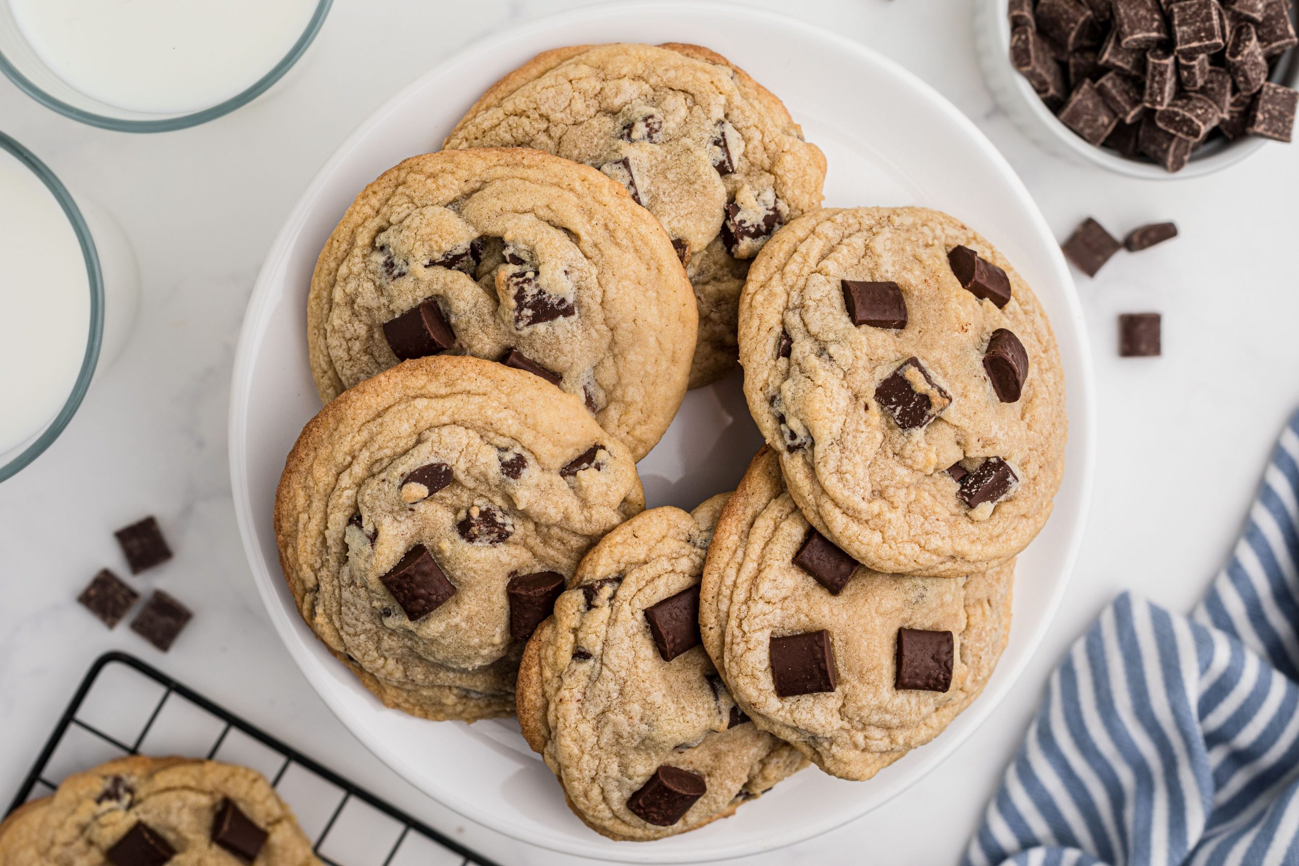 Chunky Chocolate chip cookies on a plate.
